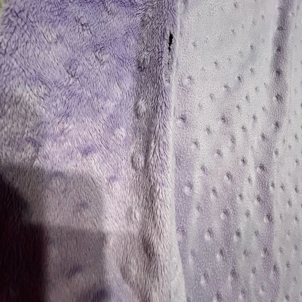 Source Unknown - Purple changing pad cover and White polka dot blanket.